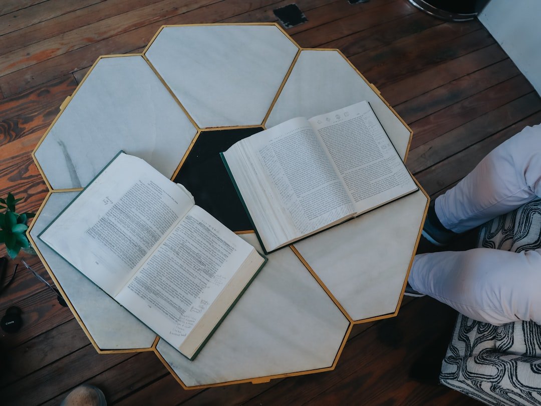 Books are open on a unique hexagon table.